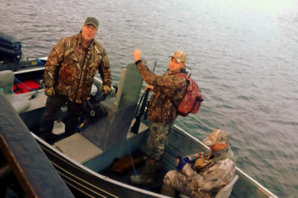 Skiff is provided to take hunters to shore for Kodiak Island deer hunting